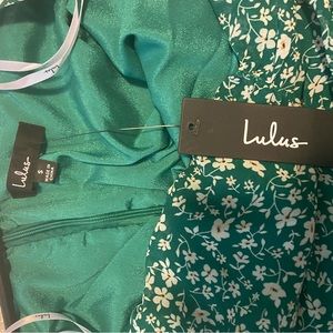 Green ditsy floral, ruched mini dress.